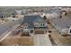 Stunning aerial view of a two-story home with a manicured lawn and surrounding neighborhood at 5404 Fawn Ridge Way, Castle Rock, CO 80104