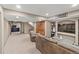 Finished basement with an open layout, carpeted floors, and cozy seating area at 5404 Fawn Ridge Way, Castle Rock, CO 80104