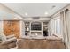 Basement living space featuring a large sofa, TV, wood-panel doors, and cozy decor at 5404 Fawn Ridge Way, Castle Rock, CO 80104