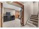 Finished basement with stairs, carpet, a dark wood door, and dark furniture at 5404 Fawn Ridge Way, Castle Rock, CO 80104