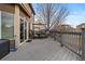 Inviting outdoor deck with a table, chairs, and an umbrella, perfect for entertaining at 5404 Fawn Ridge Way, Castle Rock, CO 80104