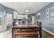 Dining area featuring a rustic wooden table and chairs, complemented by stylish decor at 5404 Fawn Ridge Way, Castle Rock, CO 80104