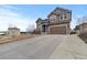 Attractive home with a spacious driveway and a well-maintained lawn at 5404 Fawn Ridge Way, Castle Rock, CO 80104