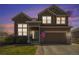 Inviting two-story home featuring a well-manicured lawn and an attached two-car garage at 5404 Fawn Ridge Way, Castle Rock, CO 80104