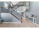 Elegant foyer featuring a staircase with decorative iron railings and neutral-toned walls at 5404 Fawn Ridge Way, Castle Rock, CO 80104