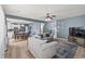 Open-concept living room seamlessly connecting to the kitchen and dining area at 5404 Fawn Ridge Way, Castle Rock, CO 80104