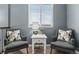 Comfortable sitting area with chairs, a table, and a large window at 5404 Fawn Ridge Way, Castle Rock, CO 80104