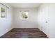 Bright bedroom features stylish wood floors, neutral walls, a bright window and closet at 4401 W Mississippi Ave, Denver, CO 80219