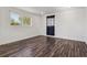 Bright bedroom features stylish wood floors, neutral walls, and abundant natural light at 4401 W Mississippi Ave, Denver, CO 80219