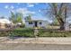 A quaint, fenced front yard enhances this property, offering a secure and charming outdoor space at 4401 W Mississippi Ave, Denver, CO 80219