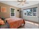 Cozy bedroom featuring hardwood floors, ample natural light, and a comfortable bed creating a relaxing retreat at 1670 Oakland St, Aurora, CO 80010