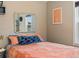 Intimate bedroom featuring a cozy bed, decorative accents, and natural light creating a warm and inviting personal space at 1670 Oakland St, Aurora, CO 80010