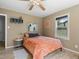 Bright bedroom featuring hardwood floors, a comfortable bed with plush pillows, and ample natural light, perfect for relaxation at 1670 Oakland St, Aurora, CO 80010