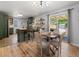 Open-concept living with dining area flowing into the kitchen and patio at 1670 Oakland St, Aurora, CO 80010