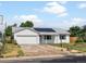 Beautiful single-story home with solar panels, attached garage, and well-manicured lawn at 1670 Oakland St, Aurora, CO 80010
