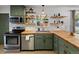 Cozy kitchen features butcher block countertops and stainless steel appliances at 1670 Oakland St, Aurora, CO 80010