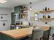 Bright kitchen featuring butcher block countertops, floating shelves and stainless steel appliances at 1670 Oakland St, Aurora, CO 80010