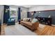 Inviting living room with hardwood floors, stylish decor, comfortable seating, and natural light creating a cozy ambiance at 1670 Oakland St, Aurora, CO 80010