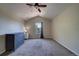 Large bedroom with vaulted ceiling, gray carpet, and natural light from a window at 12535 S Beaver Creek Way, Parker, CO 80134