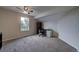 Bright bedroom featuring neutral walls, plush carpet, ceiling fan and a dedicated office/work space at 12535 S Beaver Creek Way, Parker, CO 80134
