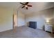 Spacious bedroom featuring neutral walls, carpet flooring, and a ceiling fan at 12535 S Beaver Creek Way, Parker, CO 80134
