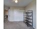 Cozy bedroom with closet, shelving unit, and carpet flooring at 12535 S Beaver Creek Way, Parker, CO 80134