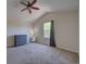 Bright bedroom with vaulted ceiling, ceiling fan, and a large window at 12535 S Beaver Creek Way, Parker, CO 80134