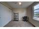 Bedroom with closet, desk, and natural light from a window at 12535 S Beaver Creek Way, Parker, CO 80134