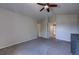 Spacious bedroom featuring neutral tones, ceiling fan, and ample closet space at 12535 S Beaver Creek Way, Parker, CO 80134
