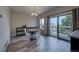 Dining area featuring a wooden table, white chairs, and a sliding glass door to a deck at 12535 S Beaver Creek Way, Parker, CO 80134