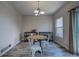 Cozy dining area with a round wooden table, white chairs, and shelving units at 12535 S Beaver Creek Way, Parker, CO 80134