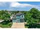 Beautiful two-story home with a three-car garage on a tree-lined street at 12535 S Beaver Creek Way, Parker, CO 80134