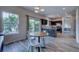 Eat-in kitchen featuring modern lighting, dark cabinetry and stainless steel appliances at 12535 S Beaver Creek Way, Parker, CO 80134