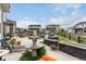Expansive backyard with multiple patios, fire pit, fountain and manicured landscaping at 5964 E 141St Ave, Thornton, CO 80602