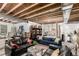 Finished basement featuring an open-concept design with living and sleeping areas at 5964 E 141St Ave, Thornton, CO 80602