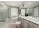 This spacious bathroom features double sinks, modern cabinets, and a separate tub and shower at 5964 E 141St Ave, Thornton, CO 80602