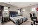Comfortable bedroom features large windows, modern bedside tables and lamps at 5964 E 141St Ave, Thornton, CO 80602