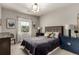 Comfortable bedroom featuring a large window and decorative accents at 5964 E 141St Ave, Thornton, CO 80602