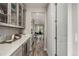 Butler's pantry featuring cabinetry, countertops, and built-in beverage refrigerator at 5964 E 141St Ave, Thornton, CO 80602