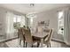 Elegant dining room featuring modern lighting and ample natural light at 5964 E 141St Ave, Thornton, CO 80602