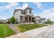 Beautiful home with landscaped yard, stone accents, and a convenient two-car garage at 5964 E 141St Ave, Thornton, CO 80602