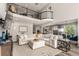 Inviting open-concept living room with an adjacent kitchen and dining area at 5964 E 141St Ave, Thornton, CO 80602