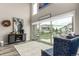 Bright living room with high ceilings, large windows, hardwood floors and an open floor plan at 5964 E 141St Ave, Thornton, CO 80602