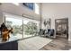 Bright living room with high ceilings, large windows and an open floor plan at 5964 E 141St Ave, Thornton, CO 80602