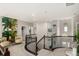 Upstairs loft with seating and unique art features a curved staircase at 5964 E 141St Ave, Thornton, CO 80602