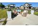 Outdoor patio area featuring a fire pit and comfortable seating, perfect for relaxing and entertaining at 5964 E 141St Ave, Thornton, CO 80602