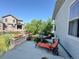 Relaxing patio with a fountain, lounge chairs, and attractive landscaping at 5964 E 141St Ave, Thornton, CO 80602