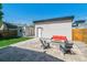 Backyard patio with a modern fire pit, comfortable seating, and a well-maintained lawn at 1911 S Lafayette St, Denver, CO 80210
