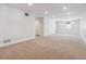 Spacious unfinished basement area with carpet flooring, recessed lighting, and a window at 1911 S Lafayette St, Denver, CO 80210