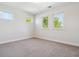 Bright bedroom with three windows, carpeted floors, and natural light, perfect for rest and relaxation at 1911 S Lafayette St, Denver, CO 80210